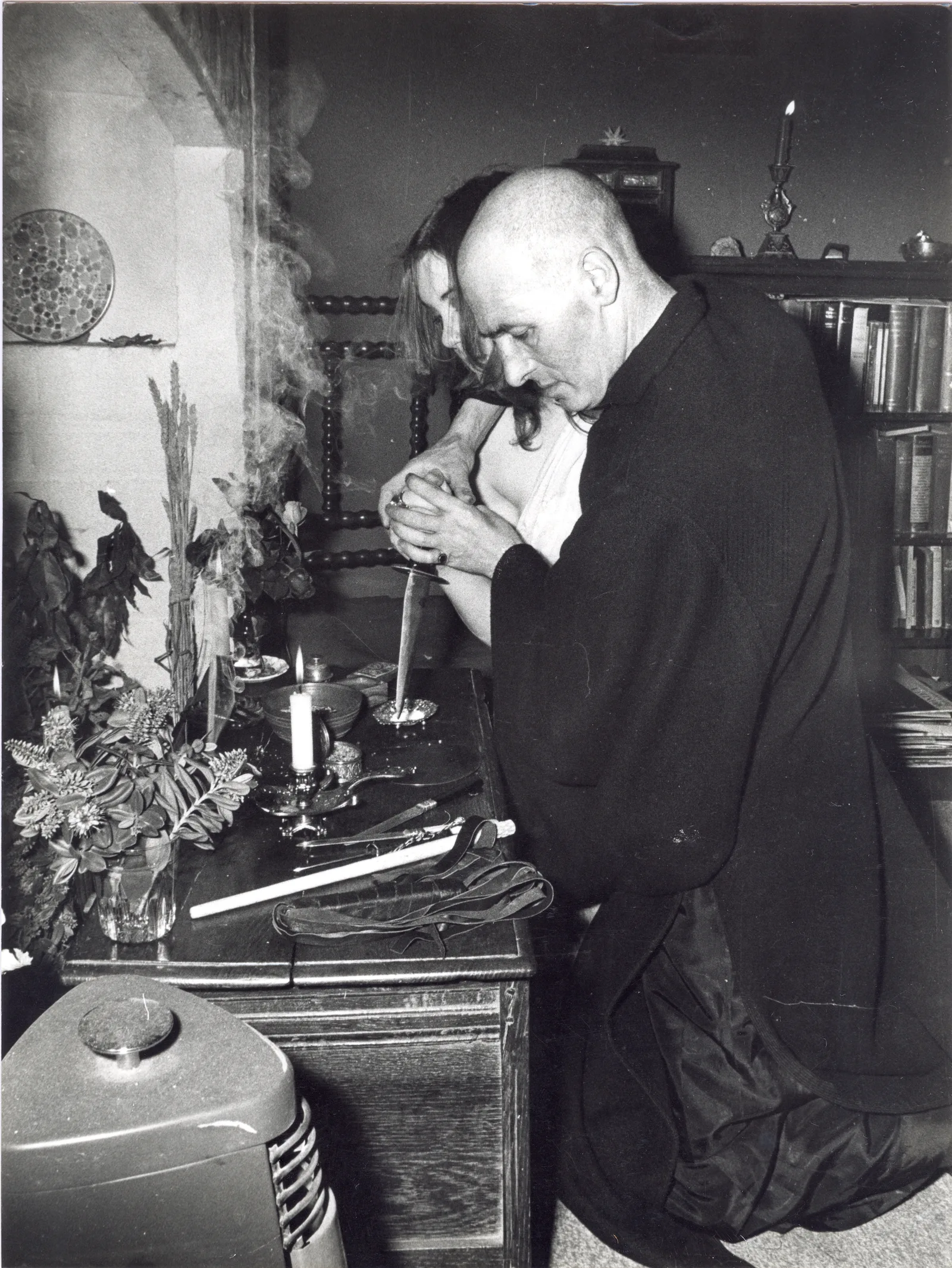Alex Sanders at the altar with a coven member, Chantry Cottage, 8 May 1974