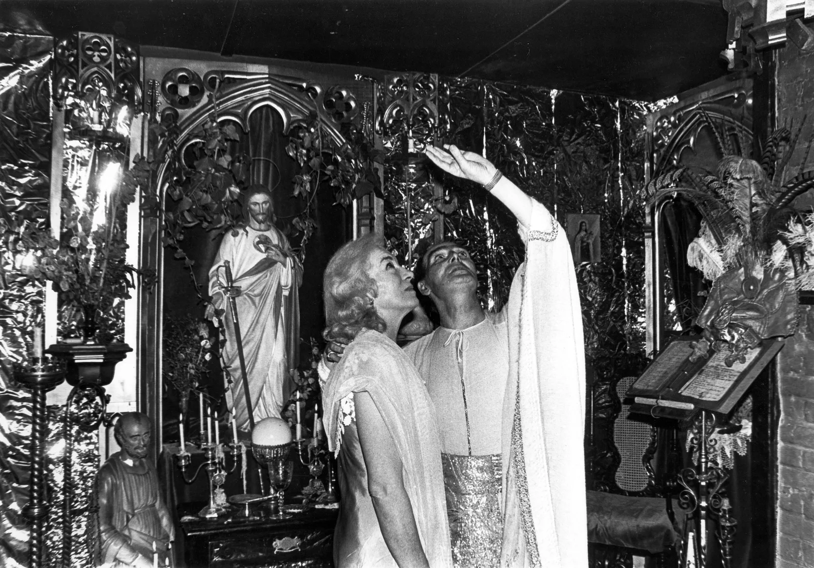 Betty Britton and Alex Sanders before the altar, Chantry Cottage, 27 October 1977