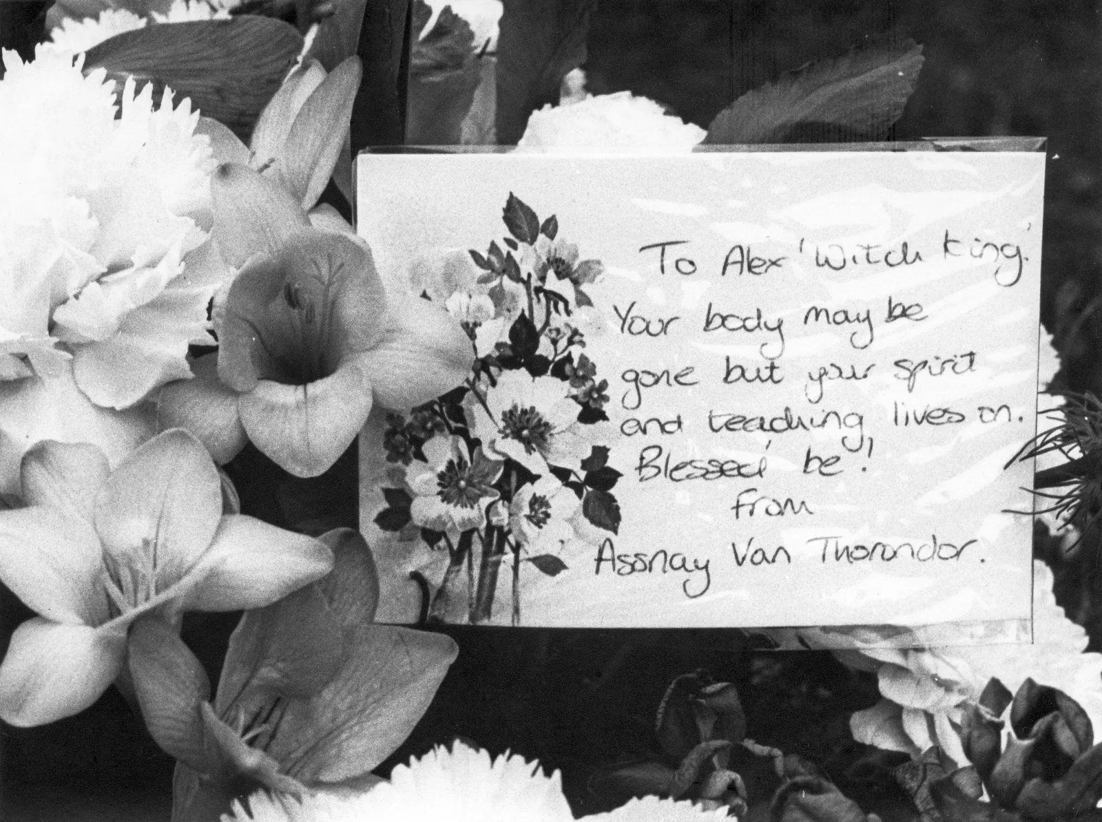 Floral tribute and card 'To Alex "Witch King"', May 1988