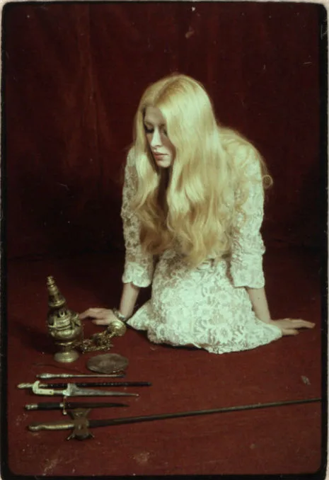 Images of Alex and Maxine Sanders with Tarot cards plus other ritual items