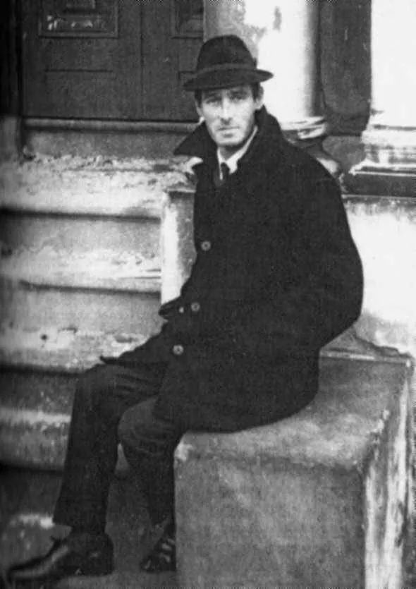 Photo: Alex Sanders sitting on steps in normal attire.